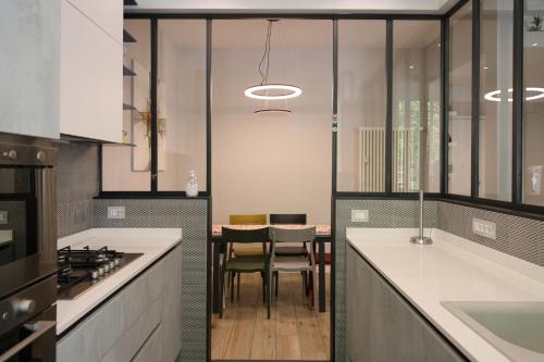 a kitchen with a table and chairs in it at Suite RHome In Vatican in Rome
