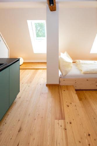 a bedroom with a bed and a window at NaturparkResort GeoApartment in Gams bei Hieflau