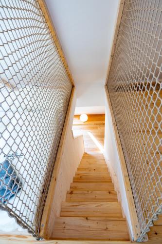 a staircase in a house with a metal net at NaturparkResort GeoApartment in Gams bei Hieflau