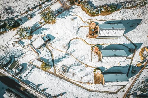an overhead view of a building in the snow at Domandi mountain holiday lodges in Przesieka