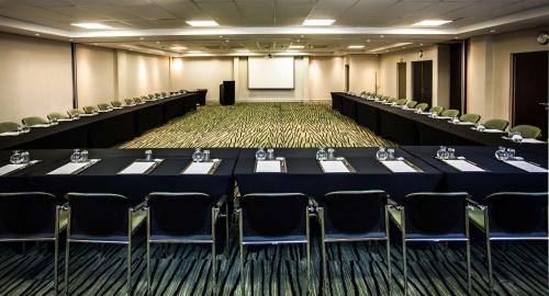 a conference room with a long table and chairs at Southern Sun Newlands in Cape Town