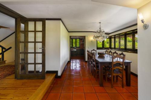 a dining room with a table and chairs at Isatour - Ninho D' Águia in Águeda