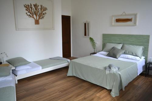 a bedroom with two beds in a room at Il frantoio di Olimpia in Lerici