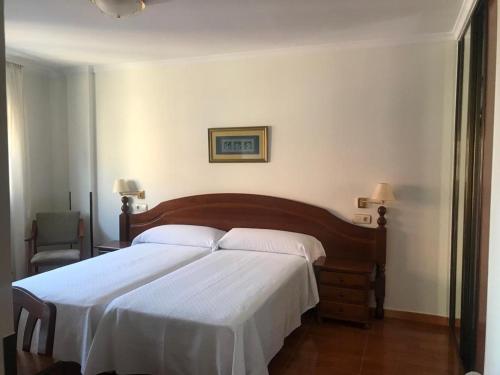 Katil atau katil-katil dalam bilik di Hostal O Portiño