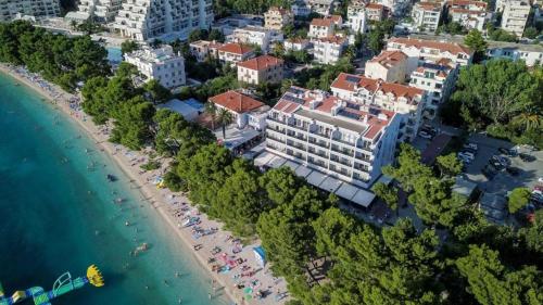 an aerial view of a resort and a beach at Luxury apartment in Hotel in Makarska