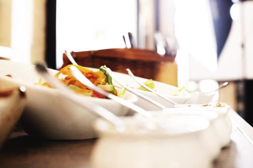 a plate of food sitting on a table at The Negev Hotel By Domus in Beer Sheva