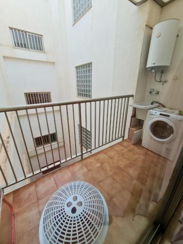 a balcony with a washing machine and a sink at Las Jarcias 3A in Moncófar