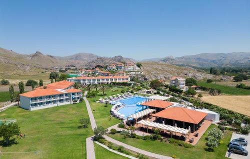 an aerial view of a resort with a pool at Aeolian Village Beach Resort in Skala Eresou