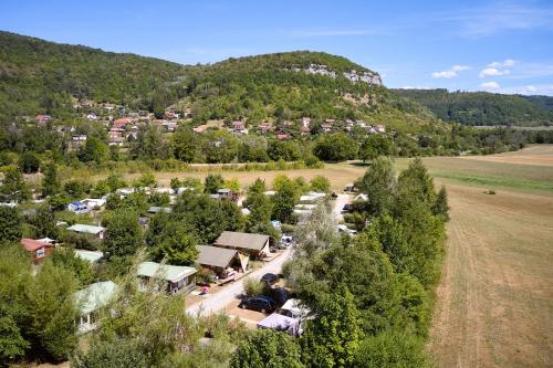 an aerial view of a campground in the mountains at Glamping Ornans in Ornans