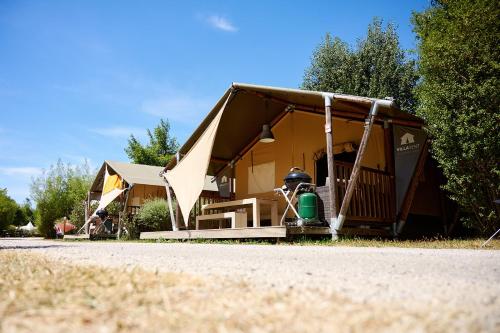 a tent that is sitting on the side of a road at Glamping Ornans in Ornans