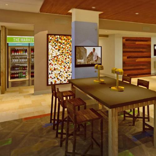 a dining room with a table and chairs in a store at Holiday Inn Express & Suites Camarillo by IHG in Camarillo