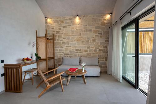 a living room with a couch and a table at Balos Beach in Kissamos