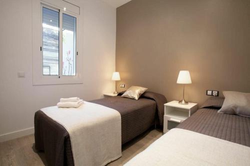 Posteľ alebo postele v izbe v ubytovaní Bed&BCN Enamorats