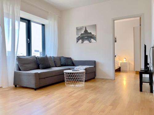 a living room with a couch and a table at Cosy 1-bedroom Apartment In Herning in Herning