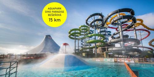 an inflatable water park with a water slide at Malinô Apartments - Chalets in Ski & Bike Park in Ružomberok