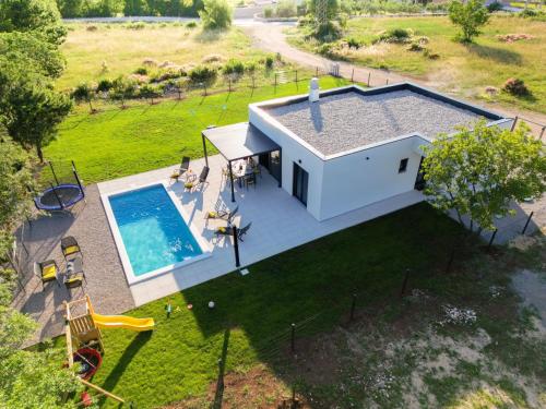 an overhead view of a house with a swimming pool at Villa Lotta in Labin