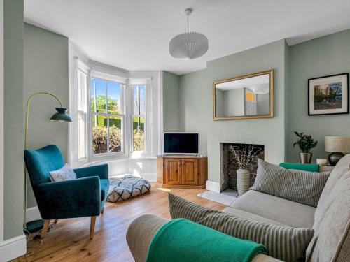 a living room with a couch and a tv at Large Terraced Home In the City - Pass the Keys in Canterbury