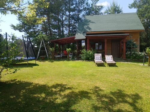 Ein Garten an der Unterkunft Domek drewniany Wiakówka