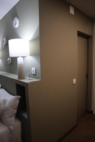 Letto o letti in una camera di CASA COELHO GUESTHOUSE