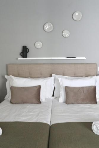 Letto o letti in una camera di CASA COELHO GUESTHOUSE
