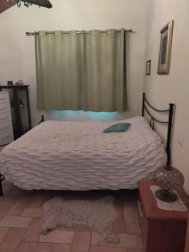 a bedroom with a large bed with a window at LoChaletCivico46 in Rome