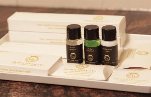 three boxes of facial products sitting on a table at Crown Himalaya in Leh