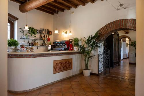 a kitchen with a counter in a room at Hotel Airone in Piadena