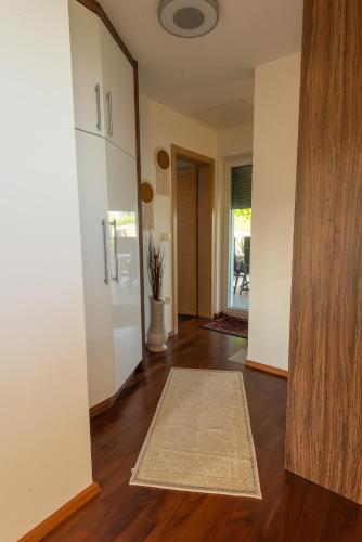 an empty living room with a rug on the floor at Vineyard cottage Jelenov hrib in Smarjeske Toplice