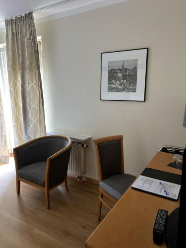Uma área de estar em Hotel Prinz