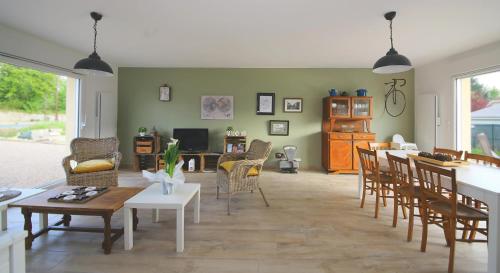a living room with a table and chairs at Bellodge in Bazeilles