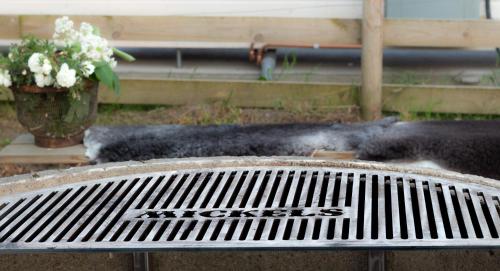 a pile of black smoke sitting on top of a bench at FARM LIVING in Gottby