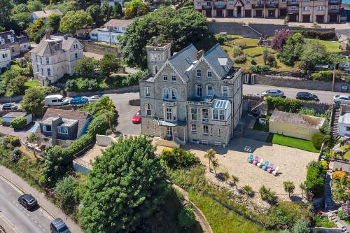 an aerial view of a large house in a city at Merlin Court in Ilfracombe
