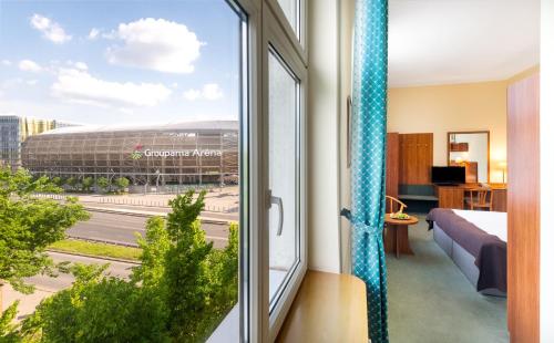 Posteľ alebo postele v izbe v ubytovaní Hotel Millennium