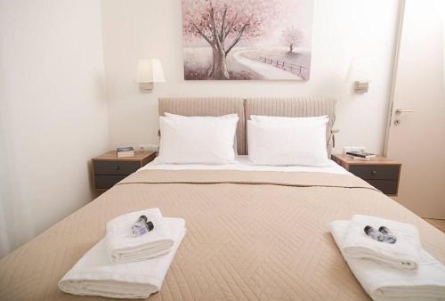 Un pat sau paturi într-o cameră la G&K House View