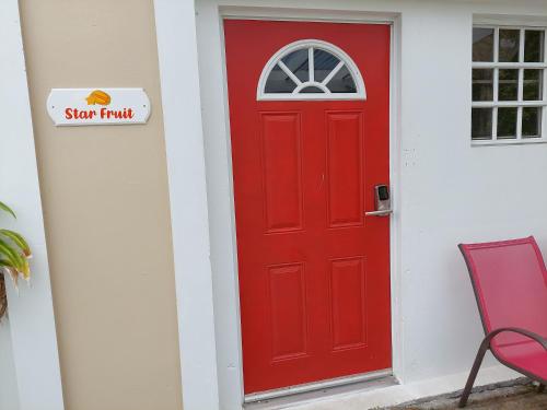a red door with a sign that reads stop fraud at One Seven Solberg in St Thomas