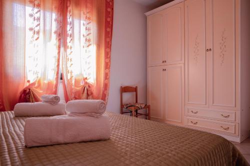 Postel nebo postele na pokoji v ubytování Appartamenti Costa - BUDONI SWEET HOME