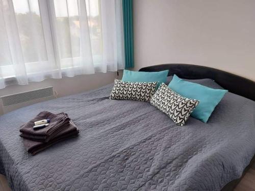 Postel nebo postele na pokoji v ubytování Kiss Apartman Juventus