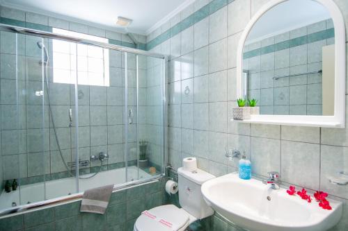 a bathroom with a toilet and a sink and a shower at Spira Studios & Apartments in the Heart of Laganas in Laganas
