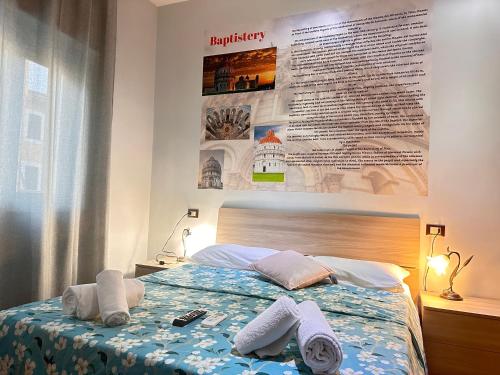 a bedroom with a bed with towels on it at five keys in Pisa