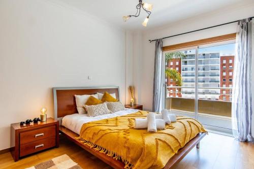 Кровать или кровати в номере Casa Encosta da Marina