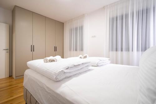 Säng eller sängar i ett rum på Mistral Retreat Zadar