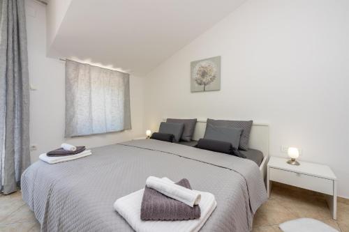 Postel nebo postele na pokoji v ubytování Villa Ruza