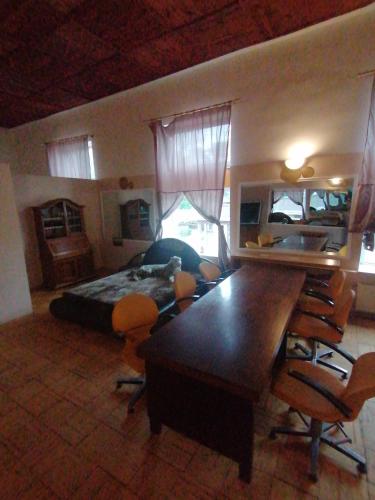 a bedroom with a bed and a table and chairs at Apartments Londa in Jūrmala