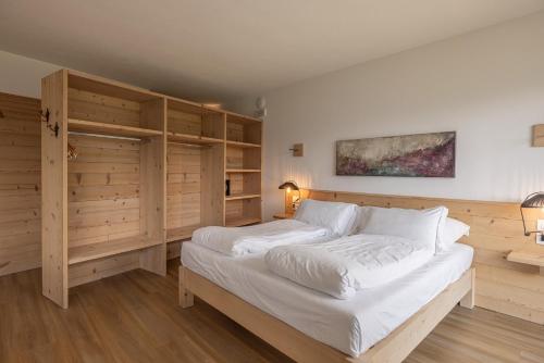 Ένα ή περισσότερα κρεβάτια σε δωμάτιο στο Giallo Dolomiti Wellness