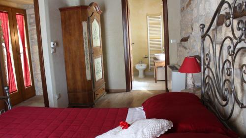 Posteľ alebo postele v izbe v ubytovaní B&B Lo Gnomo