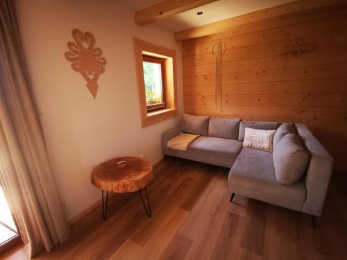 a living room with a couch and a table at Heidi in Zakopane