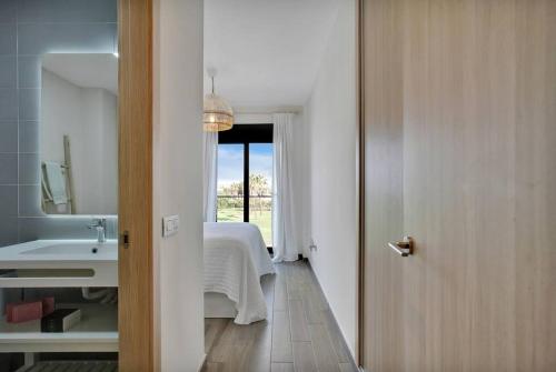 a bathroom with a bed and a sink in a room at 2 terraces apartment w/ astonishing views. in Costa de Antigua