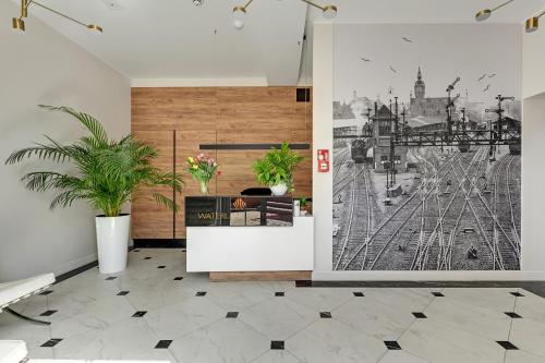 a living room with a wall mural of a city at Waterlane Vintage - Fitness & Gym by Downtown Apartments in Gdańsk