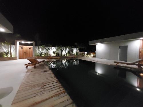 a house with a swimming pool at night at VILLA ALBA ROSULA in Ajaccio