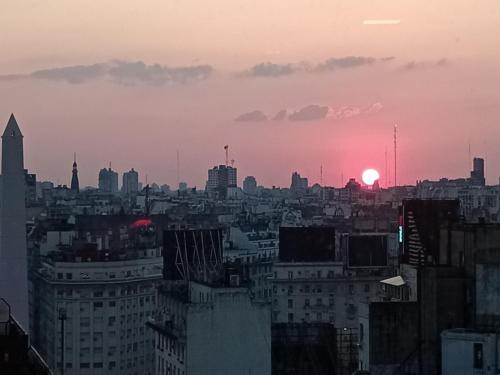 a view of a city skyline at sunset at Las Naciones 1710 in Buenos Aires